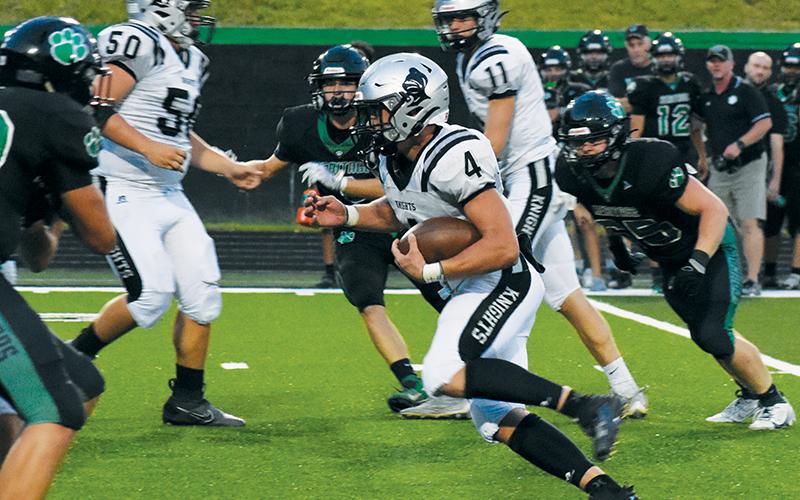 Cuttler Adams finds an open hole during Sept. 1’s game at Mountain Heritage.  Adams has recently been selected to play in a pair of prestigous showcases after his high-school career wraps up. Photo by Kevin Hensley/sports@grahamstar.com