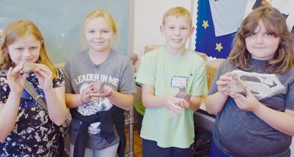 Katie McCracian, Sydney Adams, Cody Crisp and Ella Atwell (from left) show off the clay artwork they created at last week’s Arrowmont Program, held at the Stecoah Valley Cultural Arts Center. Photo by Art Miller/amiller@grahamstar.com