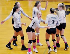 Lady Knights Kennedy Cable, Karlyn Matheson, Liz Ayers, Yeika Jimenez, Gracye Burchfield and Karcee Dooley (from left) celebrate after a point during Oct. 10’s sweep against Rosman. Photo by Kevin Hensley/editor@grahamstar.com