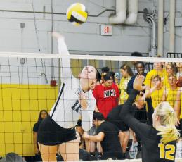 Robbinsville senior Karlyn Matheson prepares to drive one of her team-leading 29 kills onto the Murphy side of the net during Oct. 3’s road match. Photo by Noah Shatzer/Cherokee Scout