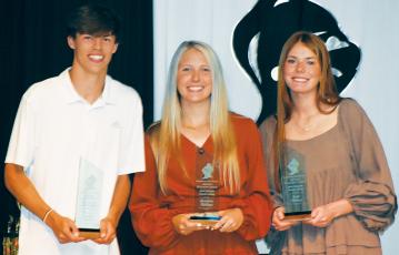 Brock Adams, Kensley Phillips and Zoie Shuler (from left) each received the prestigious Ed Jackson Award for being Robbinsville's Most Valuable male and female athletes at May 22's R-Club Banquet. Photos by Kevin Hensley/sports@grahamstar.com