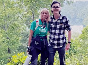 Today, Tina Wesson (left, pictured with marketing director Erik Barnett) is the  activities director at Tapoco Lodge. Over 20 years ago, she proved her outdoor  prowess by winning the long-running competition show, “Survivor.”