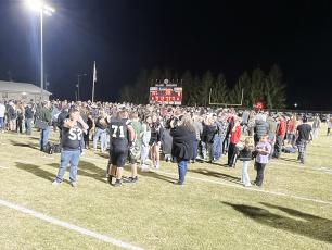 It did not take long for Bob Colvin Field to become heavily occupied Friday night, moments after the Robbinsville Black Knights secured their 27th Smoky Mountain Conference title by defeating Swain County under the Big Oaks. Photo by Kevin Hensley/sports@grahamstar.com