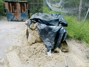Constant vandalism and a blatant disregard for  stipulations that items such as this insulation-filled bundle of debris – left at the Bear Creek convenience site Oct. 4 – need to instead be dumped at the county’s sanitation center, has propelled the department and commissioners alike to take necessary action.