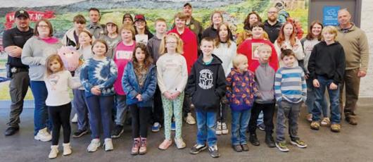 The children who participated in the Graham County Sheriff Office’s “Shop with a Cop” on Dec. 14 gather with law-enforcement officials outside Walmart in Murphy. Photos courtesy of Graham County Sheriff's Office