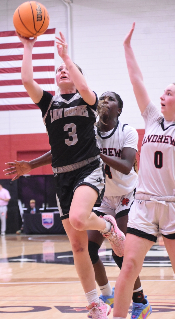 Lady Knights senior Abby Wehr (3) evades the defense of Lady Wildcats Juliet Holloway (4) and Knox Davis (0) for a second-half basket Thursday.