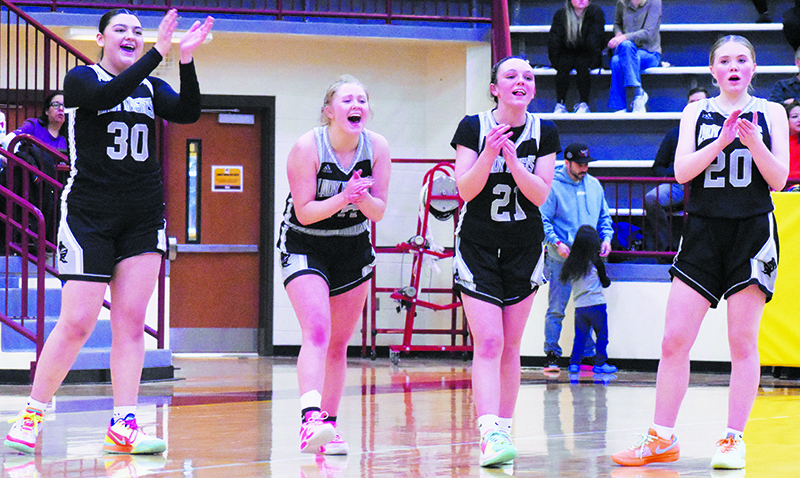 After a late technical foul was assessed Friday at Cherokee, Robbinsville’s Tiara Welch, Novie Dutcher, Chasity Jones and MyKayla McGuire (from left) erupt in celebration after Ella McGuire hits nothing but net from the charity stripe.