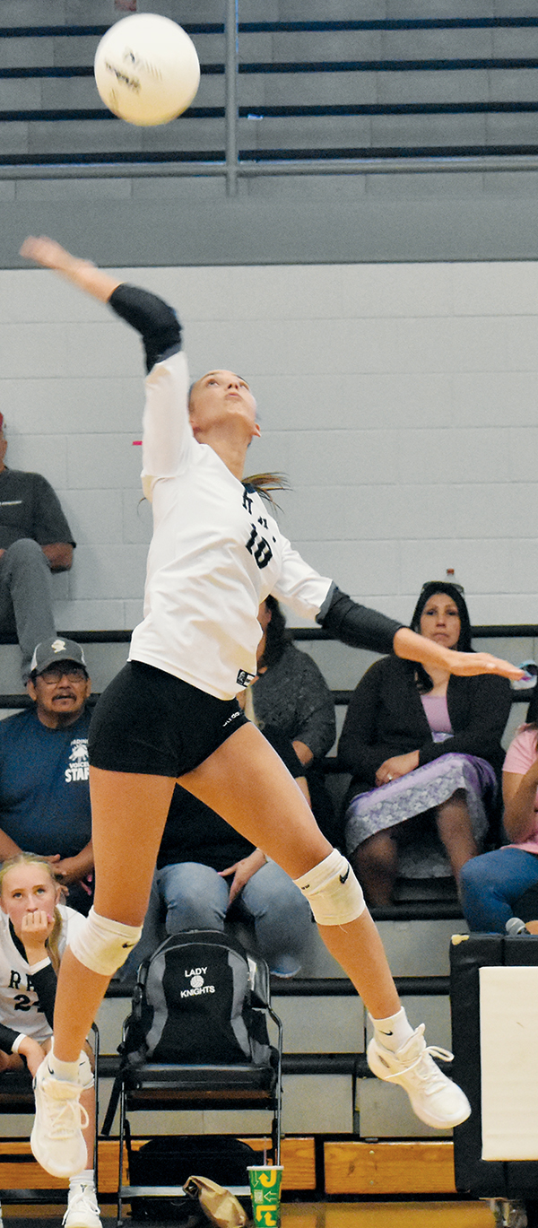 Izabel Haney leaps for a spike during Tuesday's sweep over Highlands. Photo by Bella Eddings/The Graham Star