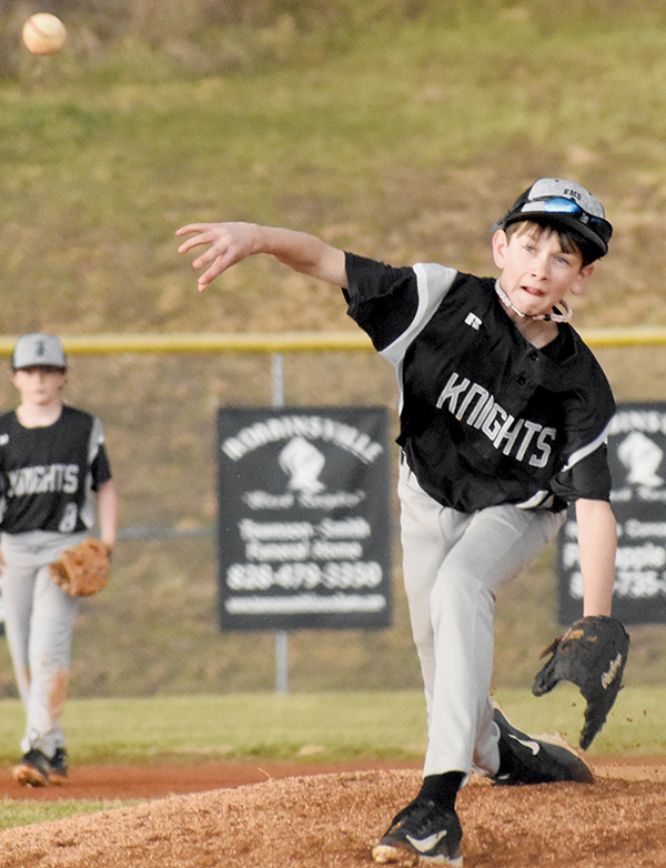 Carsan Snider delivers a pitch during March 13's rain-soaked victory over Copper Basin. Photo by Kyla Garland/The Graham Star