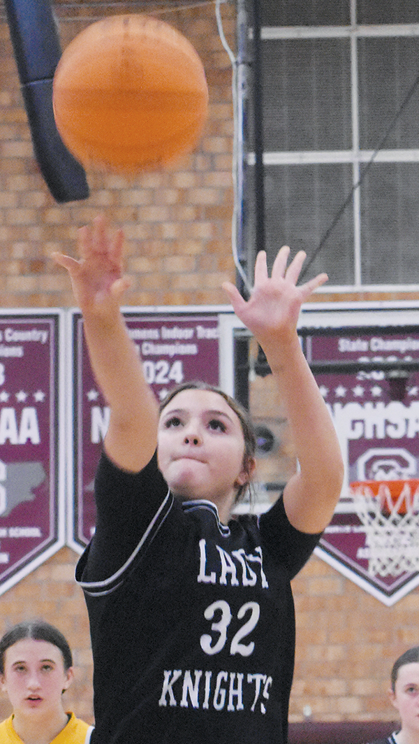 Caislee Lane fires the final point of the Lady Knights’ season Jan. 29.