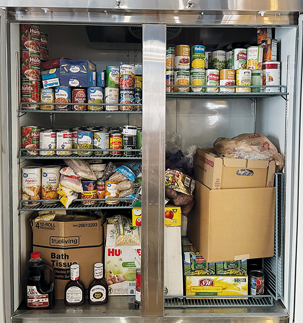 The Reigniting Hope Foundation will be utilizing items from this refrigerator to create a Thanksgiving meal for anyone who wants to stop by their new location today.