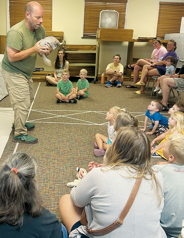 Wildlife Wonders Zookeeper Tom Bennett shows off chinchilla "Diana" for the  audience gathered at one of the four exhibitions of live animals held June 5 at the Graham County Public Library.