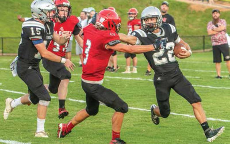 Andrews' Gage Gillespie (3) meets the stiff-arm of Robbinsville's Rylee Anderson during Friday's scrimmage at Big Oaks Stadium.