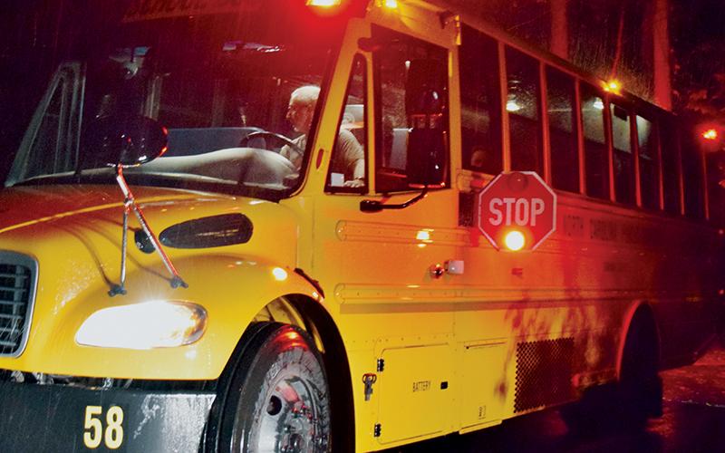 Operation Stop Arm is a week-long initative that sees officers crack down on those who offend school bus laws. Even on a rainy Tuesday morning, drivers like Bobby Howell has to make sure each student he picks up arrives at school safely. Photo by Art Miller/amiller@grahamstar.com