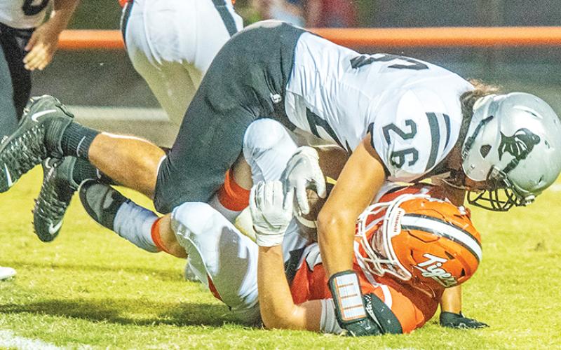 Robbinsville's Malakai Littlejohn drops a Rosman kick returner during Friday's shutout victory.