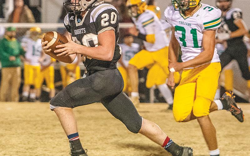 Even Alleghany defensive back Lucas Wigg (31) could not slow down Robbinsville’s Lex Hooper on Nov. 21. The Knights’ running back scored three touchdowns in a 40-22, second-round playoff win over the Trojans. Photos by Byron Housley/The Graham Star