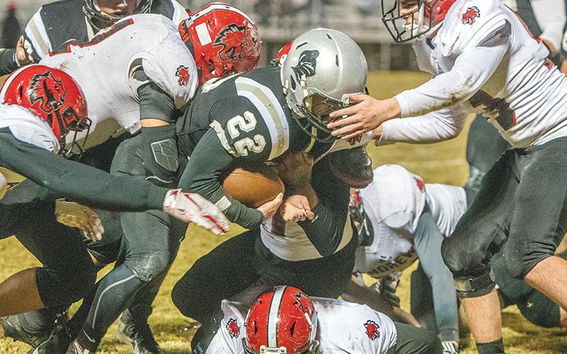 Surrounded by a pack of Wildcats – six to be exact – Robbinsville senior Rylee Anderson trucks ahead during Friday’s 28-7 win over Andrews. Anderson broke the all-time Black Knights rushing record in the fourth quarter of the game. Photo by Byron Housley/The Graham Star