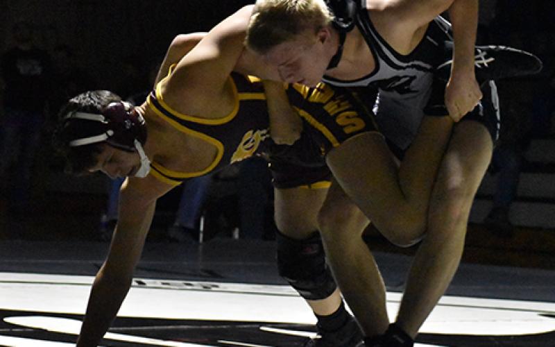 Robbinsville’s Willie Riddle has Cherokee’s John Bradley all tripped up during  Tuesday’s Smoky Mountain Conference opener. Photo by Kevin Hensley/editor@grahamstar.com