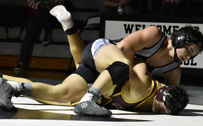 Robbinsville’s Kyle Fink prepares to pin Cherokee’s Ian Crowe during a Dec. 17 home dual against the Braves. Photo by Kevin Hensley/editor@grahamstar.com