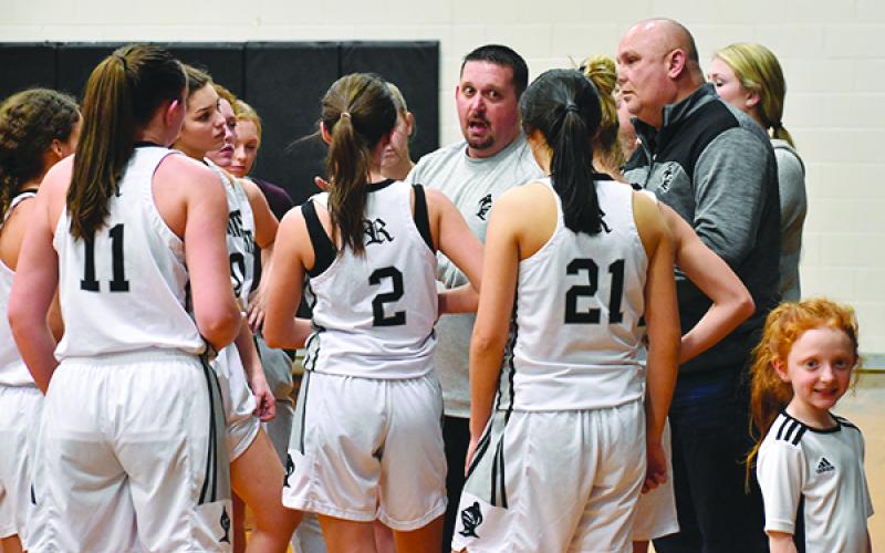 Lady Knights head coach Lucas Ford speaks to his team during a timeout Monday against Murphy. Photos by Kevin Hensley/editor@grahamstar.com