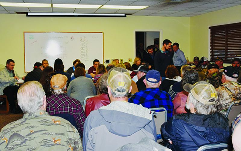 The meeting room, hallway and lobby of the Graham County Public Library were packed Feb. 5, when the Town of Robbinsville once again discussed the possibility of putting alcohol sales on the ballot. Photo by Art Miller/amiller@grahamstar.com