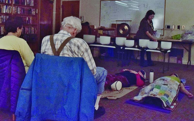 The dulcet tones of singing bowls lulled those in attendance at the Graham County Public Library on Tuesday, Jan. 28 into a deep, relaxing state. Photo by Art Miller/amiller@grahamstar.com