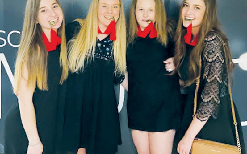 Anna Riddle, Maggie Knight, Sydney Farley and Tayla Millsaps (from left) won first place in the Performance category at the competition.