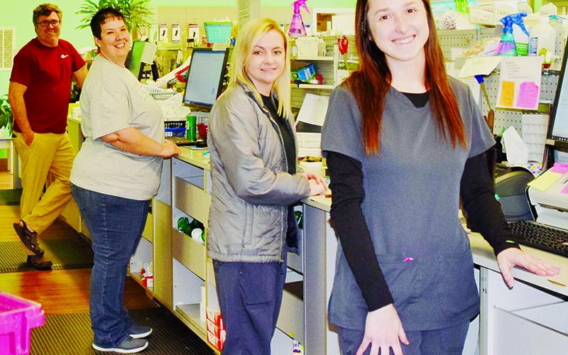 Robbinsville Pharmacy is one of several businesses in Graham County that has stayed opened throughout the COVID-19, making sure customers can still obtain essential products. Pictured from back is Robbinsville Pharmacy owner Mike Spinn, Wendy Millsaps, Chessney Flowers and Grace Millsaps. Photos by Art Miller/amiller@grahamstar.com