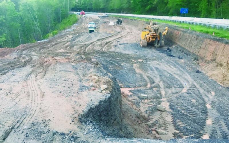 Work is underway to fix an area along U.S. 74 between the Hyatt Creek exit and Bryson City, that has long had cracks in the road and a slow-moving slide. Photo by Terry Greene/Smoky Mountain Times
