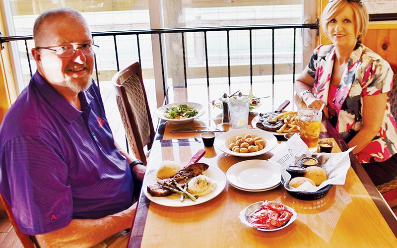 Graham County residents Marlon (left) and Cathy Jackson enjoy steak and brisket at Moonshiner  Steakhouse on Friday.