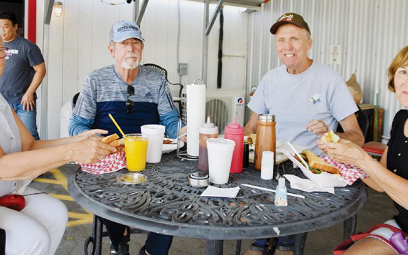 The Hub has a wide range of notoriety, as evidenced by Roberta Guendelsberger, Tim Dowling, and David and Susan Picz (from left) of Palm Shore stopping to dine in Saturday.