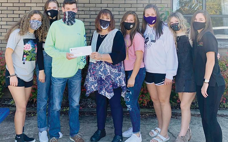 The Robbinsville High School Student Council raised and donated $100 toward the purchase of the food truck for Graham County Schools. From left in the photo is Robbinsville Student Council members Lina Pagan, Lindsey Brittain, Student Body President Dalson Jordan, Graham County Schools Superintendent Angie Knight, Ally Ayers, Ivy Odom, Caylin Lunsford and Keylie Jordan.