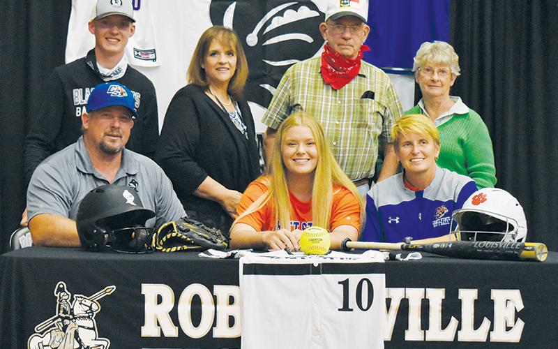 Robbinsville’s Maggie Knight (seated, center) signed her letter of intent to play softball at Chattanooga State on Tuesday, Nov. 10. Sitting with Maggie is father Billy and mother Joanne Knight. Standing in back (from left) are cousin Alex Knight, aunt Angie Knight, and grandparents Randy and Velvie Knight. Photo by Kevin Hensley/editor@grahamstar.com