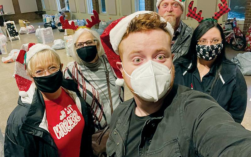 Cameron Hancock (front), Maria Shook, Barbara Hancock, Jeff Hancock and Julie Hancock (back row, from left) worked tirelessly to help provide Christmas for 81 families, on behalf of the Smoky Mountain Foundation.