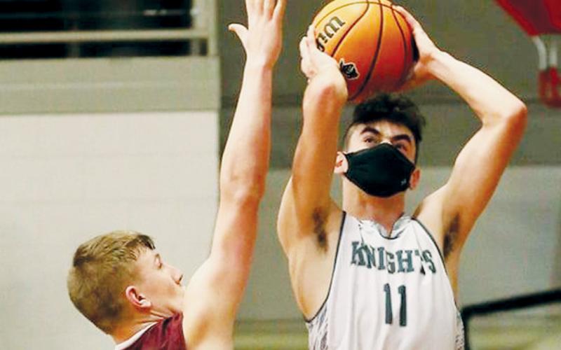 Jeb Shuler puts up a first-half jumper against Swain County on Friday. Photo by Miranda Buchanan/Robbinsville High School Yearbook