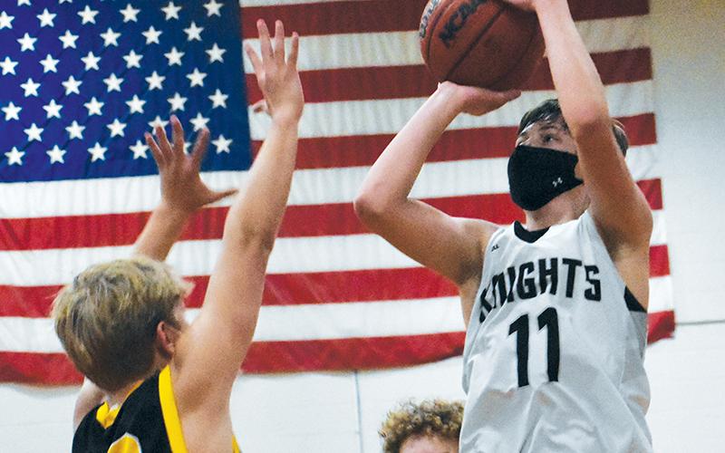 Robbinsville Middle School’s Bryce Adams puts up a floater during a home game with Murphy on Jan. 25. Adams dropped 30 points on the Swain County Maroon Devils in the Knights’ 68-62 road win on Jan. 27. Photo by Kevin Hensley/editor@grahamstar.com