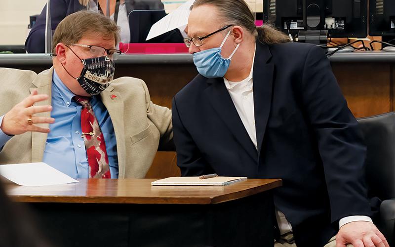 Defense attorney Rich Cassady (left) speaks with his client, Jackie Slaughter, at trial last week in the Cherokee County Courthouse. Photo courtesy of Quintin Ellison Photography