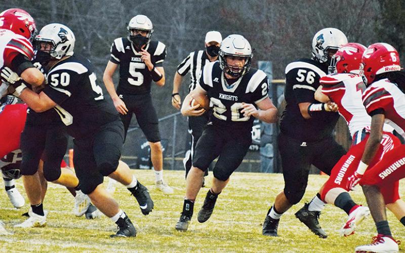 Linemen Candler Edwards (50) and Carlos Wesley (56) create an opening for running back Lex Hooper during Friday’s home game against Erwin. Hooper had three touchdowns in the first half. Photos by Art Miller/amiller@grahamstar.com