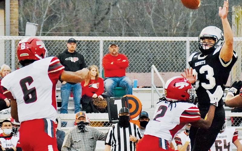 Kage Williams (33) looks to deflect a pass from Erwin quarterback Korey Griffith on Friday.