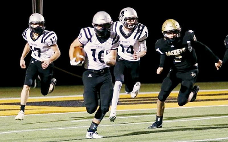 Senior Wade Hamilton takes off with one of four Robbinsville interceptions the Knights picked off in Friday’s win. Photos by Miranda Buchanan/Robbinsville High School Yearbook