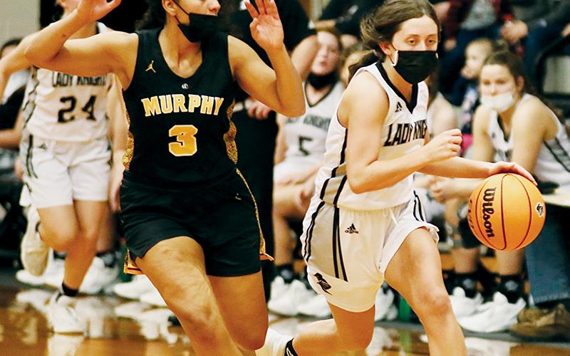 Robbinsville senior Gabby Hooper (right) looks to outpace Murphy’s Kaiya Pickens during Saturday’s third-round playoff matchup. Photo by Montana Buchanan/Robbinsville High School Yearbook