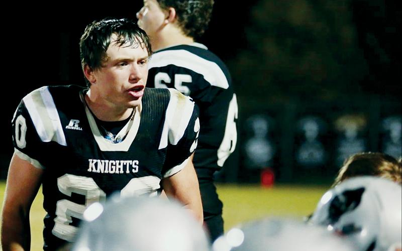 Senior running back Lex Hooper (20) pumps up his teammates during Friday’s first-round playoff matchup against Winston-Salem Preparatory Academy. Robbinsville would edge the Phoenix 42-40 for a wild double-overtime victory. Photos by Miranda Buchanan/Robbinsville High School Yearbook