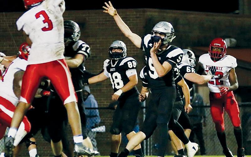 Nathan Collins (5) eyes an overtime pass during Friday’s showdown with the Winston-Salem Phoenix. Collins’ pass would be complete to Lex Hooper, who scored on the play and kept the Knights’ playoff hopes alive.