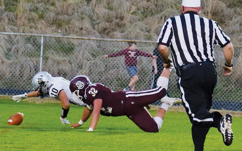 Wade Hamilton (10) stretches to recover Carson Taylor’s fumble in the end zone, during the first quarter of Friday’s road game at Swain County. The recovery set off a 38-point first half for Robbinsville, en route to a resounding victory over the Devils. Photos by Art Miller/amiller@grahamstar.com
