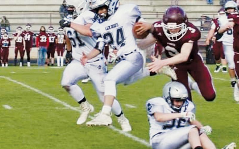 Alexis Panama (24) evades a Swain defender during a carry in April 1’s game. Panama was named the Robbinsville Black Knights junior varsity MVP after April 8’s road finale at Rosman, which saw Robbinsville clinch a share of the Smoky Mountain Conference title. Photo by Miranda Buchanan/Robbinsville High School Yearbook
