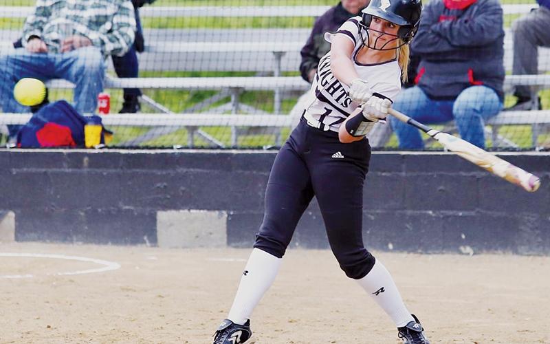 Taelyr Jackson prepares for a connection during Friday’s home game against Andrews. Jackson’s cut would result in an RBI for the Lady Knights. Photo by Miranda Buchanan/Robbinsville High School Yearbook