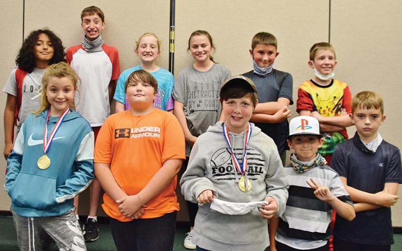 Students that participated in the first day of the inaugural 21st Century Pinewood Derby were (front row, from left): Caislee Lane, Raith Hooper, Kayden Grindstaff, Deacon Stewart and Kam Woods. Back row (from left) are David Guzman, Alex Cook, Alyssa Fowler, Chloe Adams, Randy Booth and D.J. Fowler. Not pictured is Kimberlyn Hill, who received the Most Creative Award.