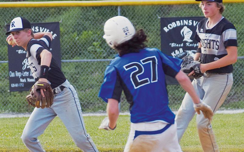 Robbinsville’s Greylon Orr (left) looks to turn the second leg of a double play Friday against Hiwassee Dam. Photo by Art Miller/amiller@grahamstar.com