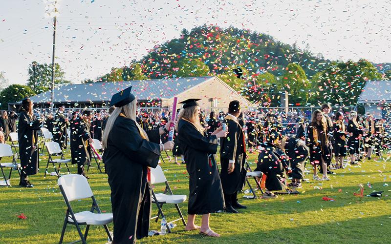 Robbinsville High School graduates begin celebrating their achievement at the end of Sunday’s commencement. For more photos from the evening, see page 3. Photos by Art Miller/amiller@grahamstar.com