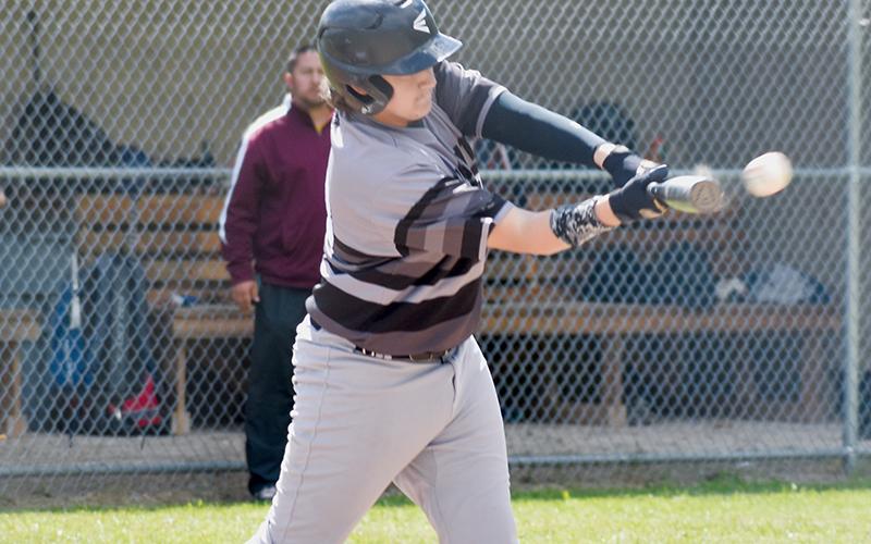 Avery Webster connects for an RBI single during the May 13 win over Cherokee. Photos by Kevin Hensley/sports@grahamstar.com